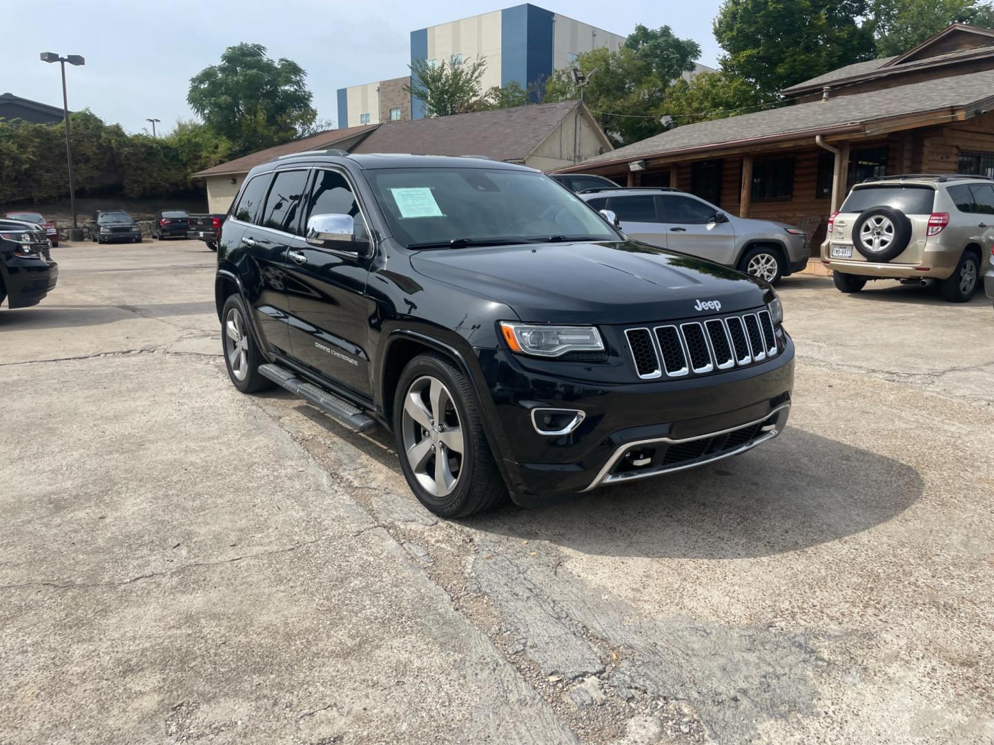 2014 Jeep Grand Cherokee Overland 4WD (1C4RJFCT9EC) with an 5.7L V8 OHV 16V engine, 5-Speed Automatic transmission, located at 945 E. Jefferson Blvd, Dallas, TX, 75203, (214) 943-7777, 32.752514, -96.811630 - Photo#3