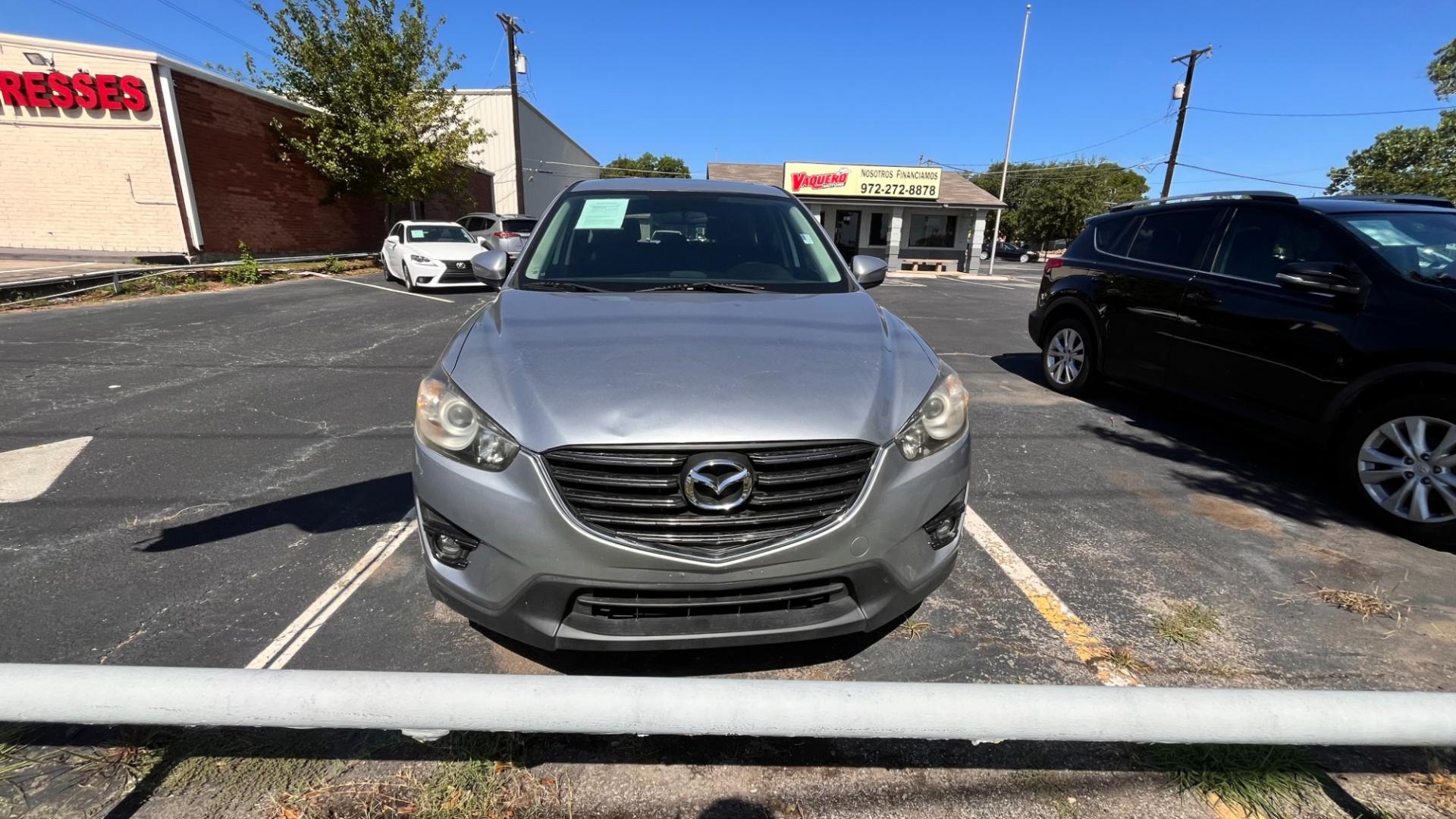 2016 Silver Mazda CX-5 Touring (JM3KE2CY7G0) with an 2.5L L4 DOHC 16V engine, 6-Speed Automatic transmission, located at 945 E. Jefferson Blvd, Dallas, TX, 75203, (214) 943-7777, 32.752514, -96.811630 - Photo#1