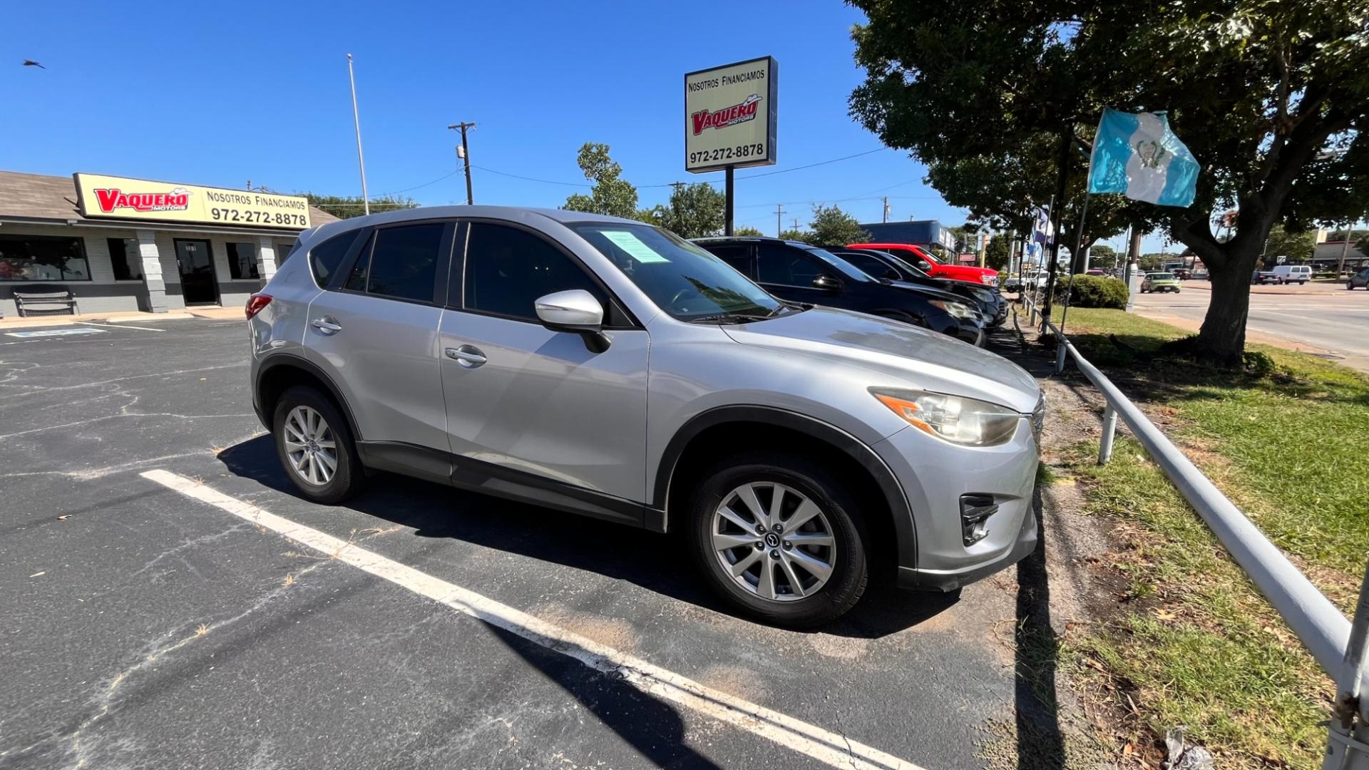 2016 Silver Mazda CX-5 Touring (JM3KE2CY7G0) with an 2.5L L4 DOHC 16V engine, 6-Speed Automatic transmission, located at 945 E. Jefferson Blvd, Dallas, TX, 75203, (214) 943-7777, 32.752514, -96.811630 - Photo#2