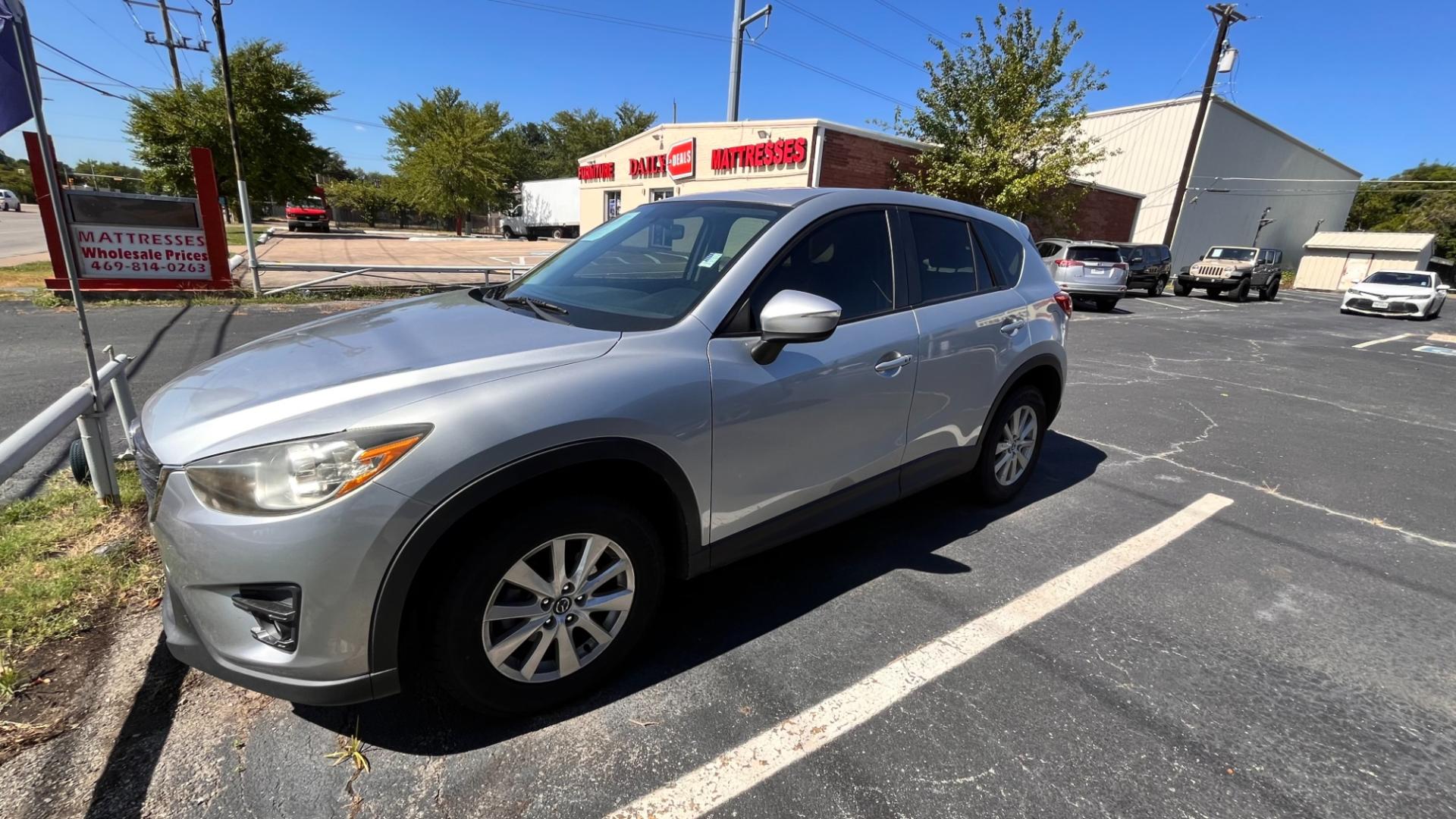 2016 Silver Mazda CX-5 Touring (JM3KE2CY7G0) with an 2.5L L4 DOHC 16V engine, 6-Speed Automatic transmission, located at 945 E. Jefferson Blvd, Dallas, TX, 75203, (214) 943-7777, 32.752514, -96.811630 - Photo#0