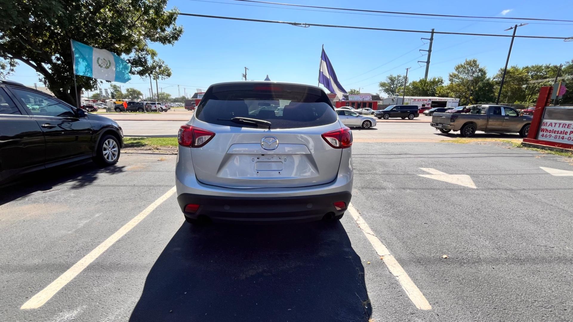 2016 Silver Mazda CX-5 Touring (JM3KE2CY7G0) with an 2.5L L4 DOHC 16V engine, 6-Speed Automatic transmission, located at 945 E. Jefferson Blvd, Dallas, TX, 75203, (214) 943-7777, 32.752514, -96.811630 - Photo#3