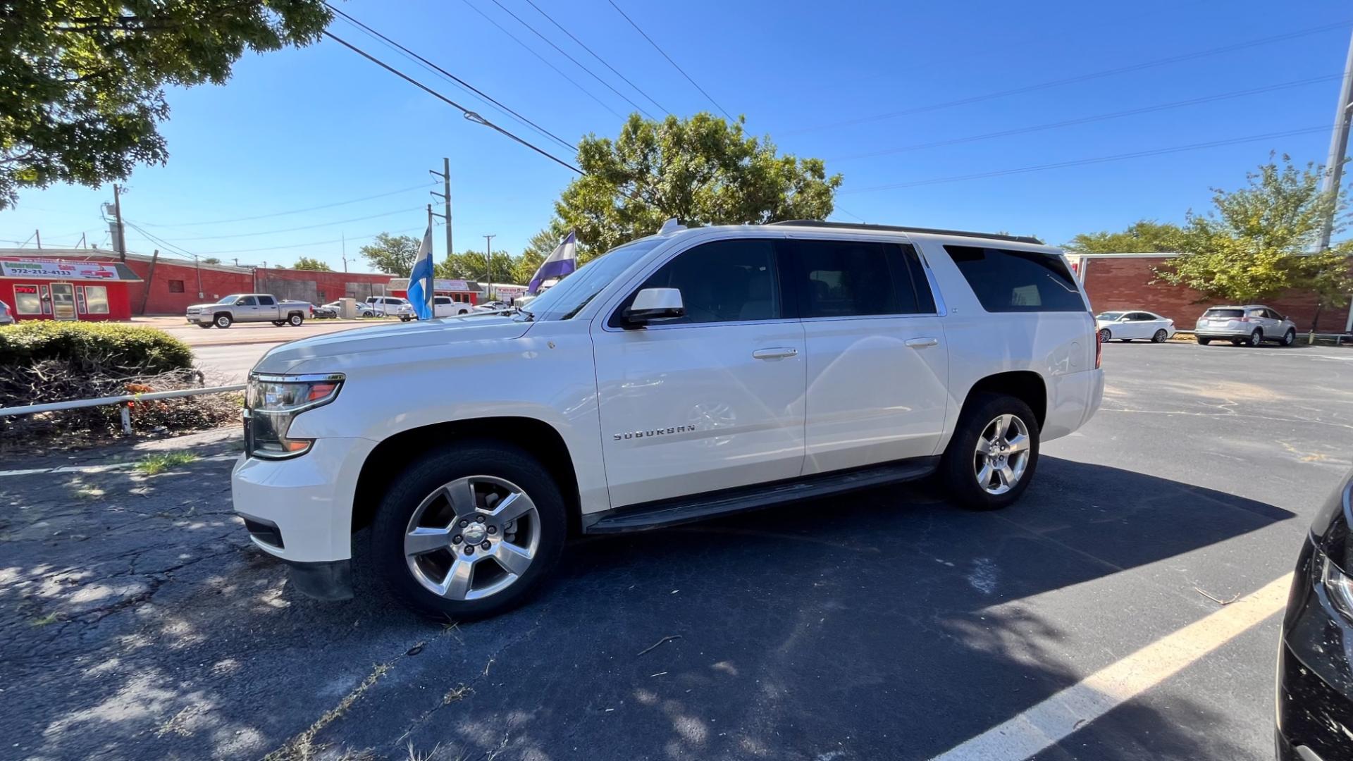 2015 Cream Chevrolet Suburban LT 1500 4WD (1GNSKJKCXFR) with an 5.3L V8 OHV 16V engine, 6-Speed Automatic transmission, located at 945 E. Jefferson Blvd, Dallas, TX, 75203, (214) 943-7777, 32.752514, -96.811630 - Photo#0