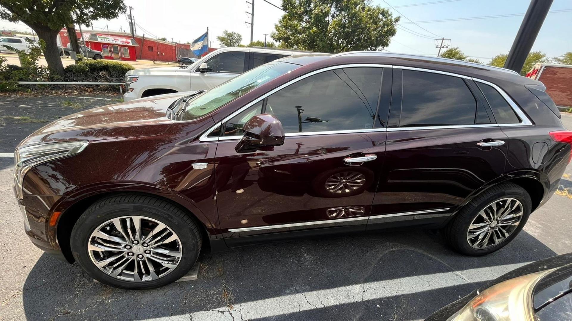 2017 Maroon Cadillac XT5 (1GYKNERS2HZ) , located at 945 E. Jefferson Blvd, Dallas, TX, 75203, (214) 943-7777, 32.752514, -96.811630 - Photo#0