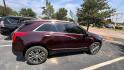 2017 Maroon Cadillac XT5 (1GYKNERS2HZ) , located at 945 E. Jefferson Blvd, Dallas, TX, 75203, (214) 943-7777, 32.752514, -96.811630 - Photo#2