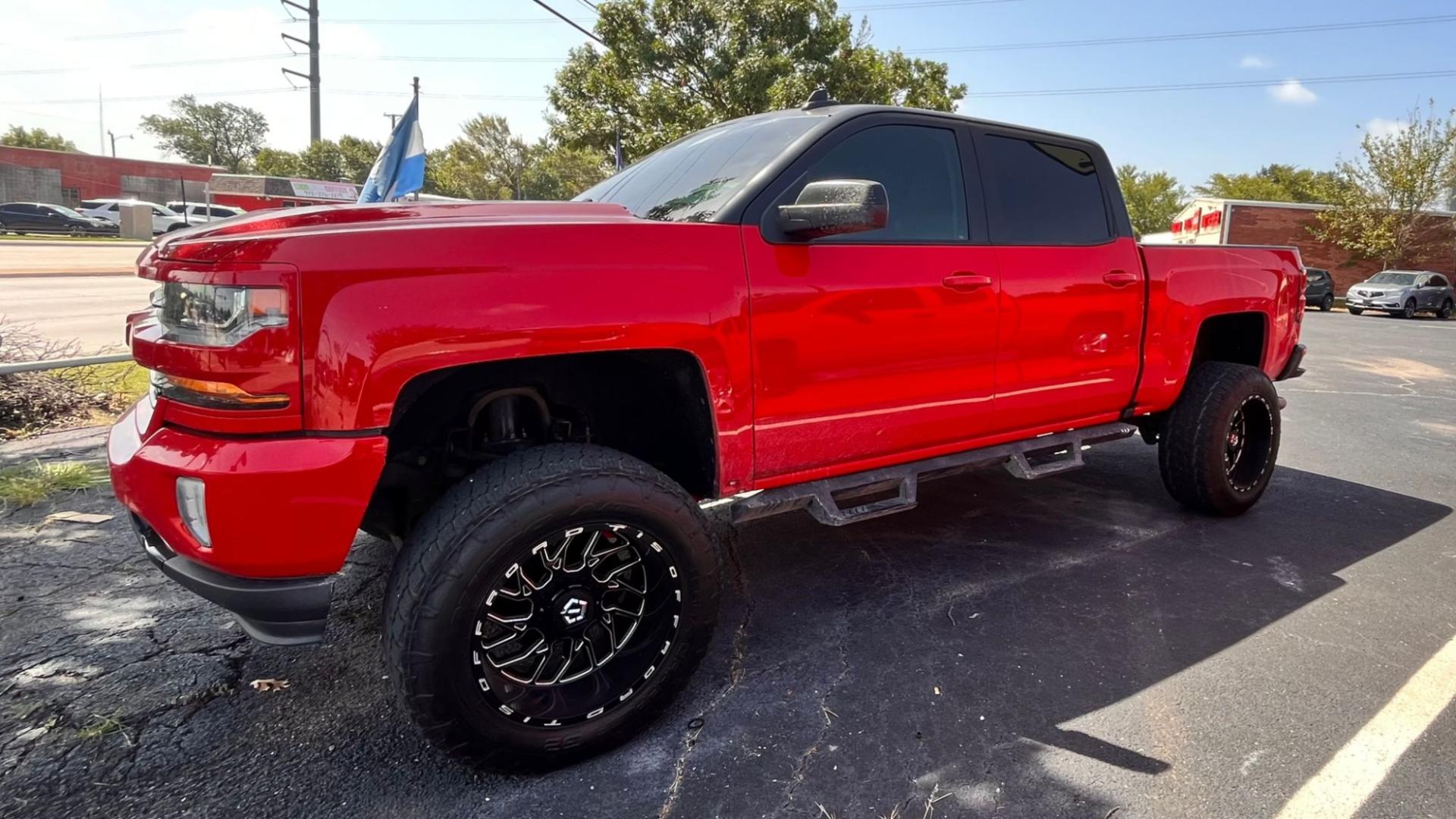 2017 Red /Black Chevrolet Silverado 1500 LT Crew Cab 4WD (3GCUKREC8HG) with an 5.3L V8 OHV 16V engine, 6A transmission, located at 945 E. Jefferson Blvd, Dallas, TX, 75203, (214) 943-7777, 32.752514, -96.811630 - Photo#0