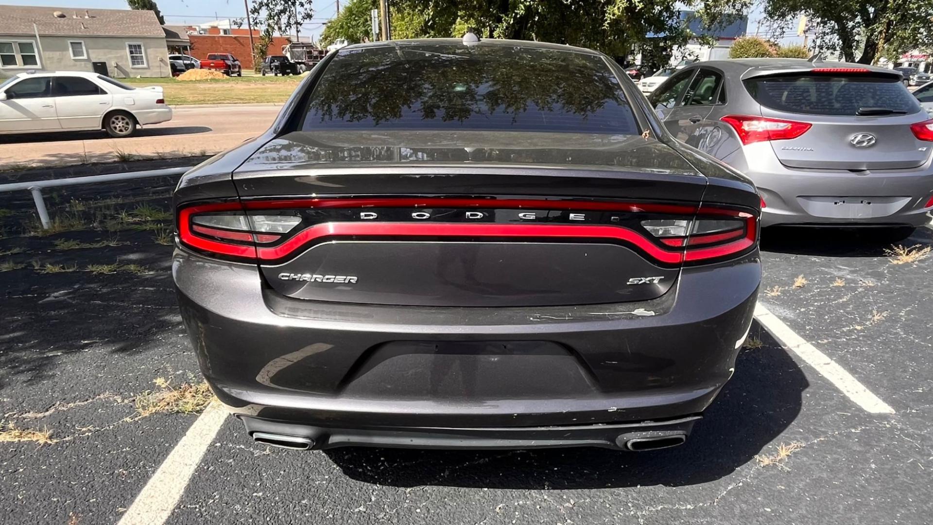 2016 Gray Dodge Charger SXT (2C3CDXHG8GH) with an 3.6L V6 DOHC 24V engine, 8A transmission, located at 945 E. Jefferson Blvd, Dallas, TX, 75203, (214) 943-7777, 32.752514, -96.811630 - Photo#3