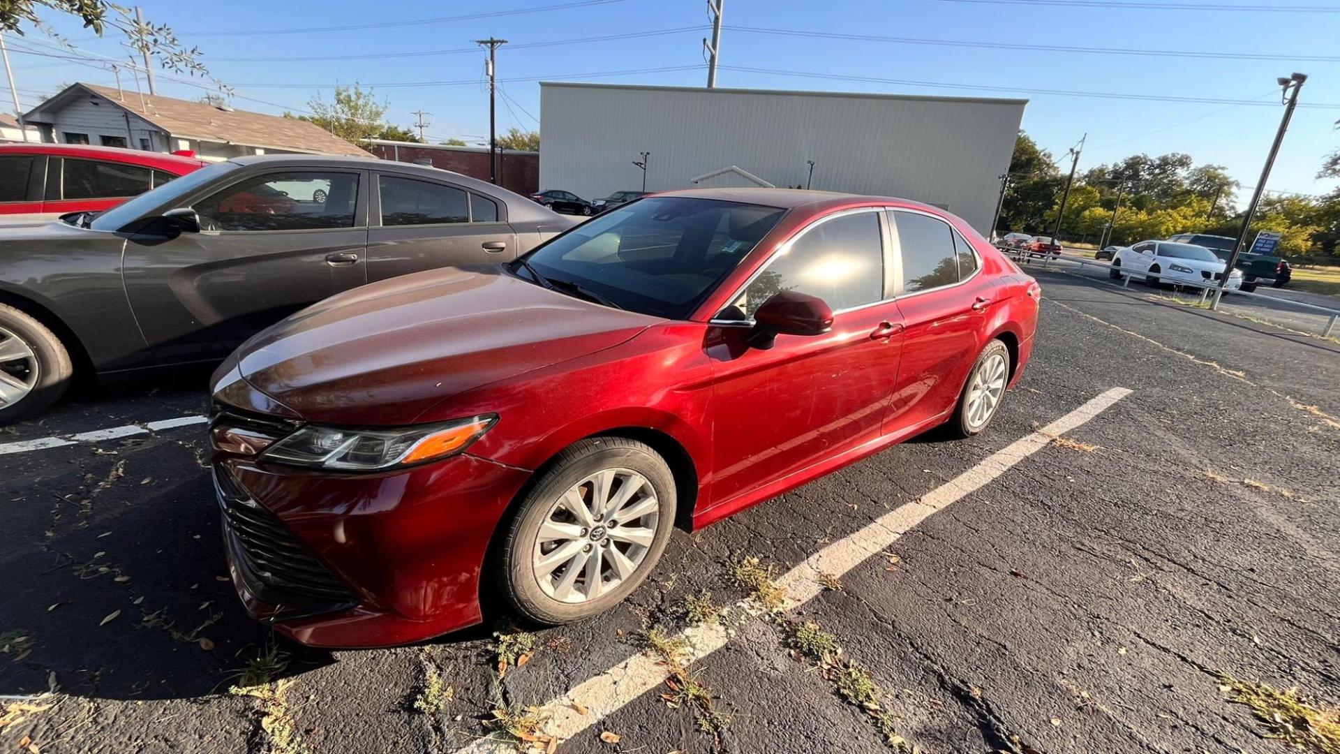 2020 Red Toyota Camry LE (4T1C11AK8LU) with an 2.5L L4 DOHC 16V engine, 8A transmission, located at 945 E. Jefferson Blvd, Dallas, TX, 75203, (214) 943-7777, 32.752514, -96.811630 - Photo#0