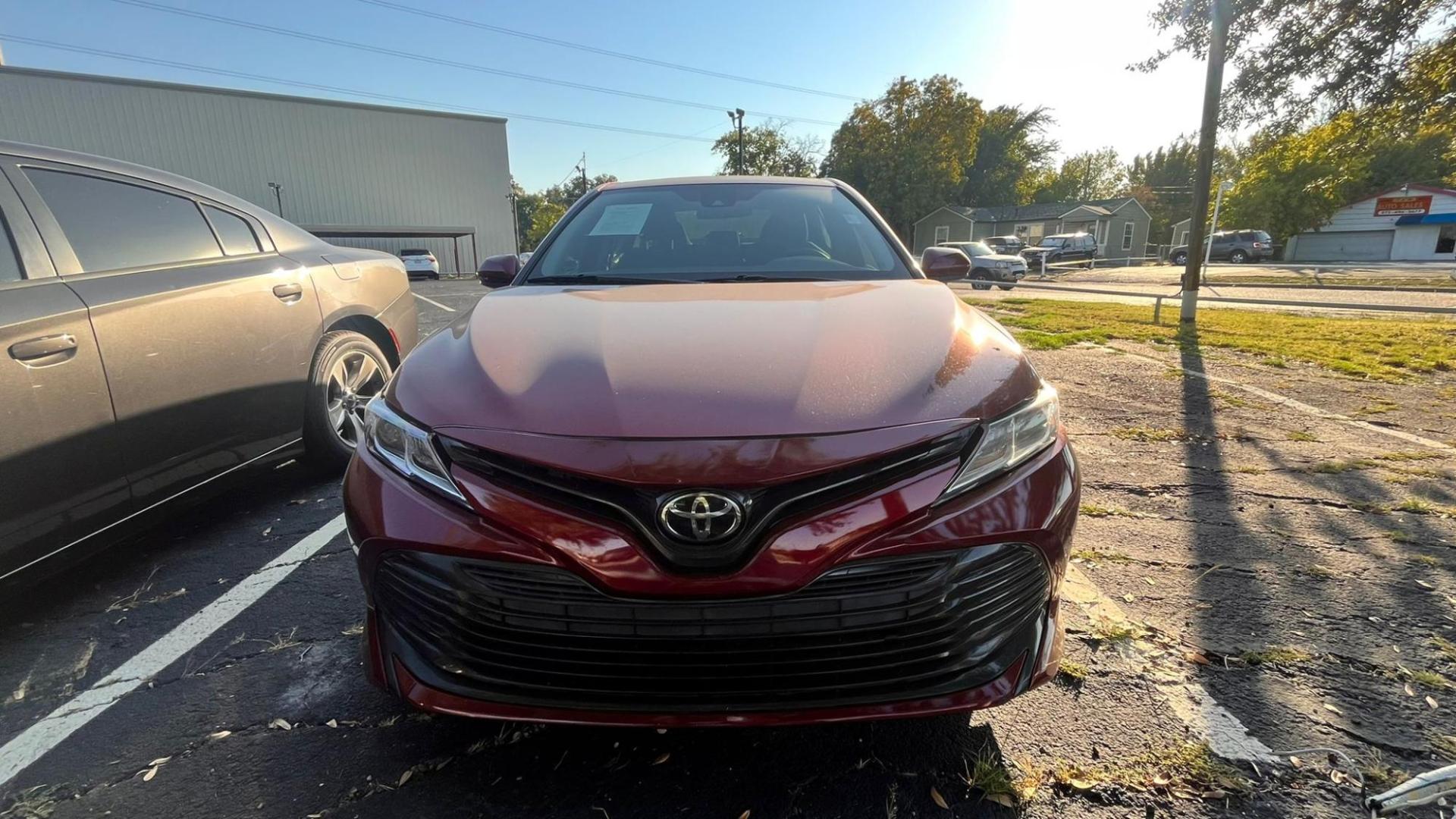 2020 Red Toyota Camry LE (4T1C11AK8LU) with an 2.5L L4 DOHC 16V engine, 8A transmission, located at 945 E. Jefferson Blvd, Dallas, TX, 75203, (214) 943-7777, 32.752514, -96.811630 - Photo#1