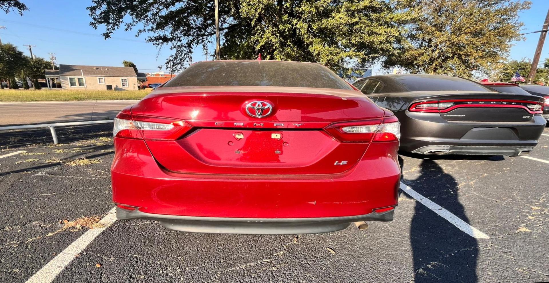 2020 Red Toyota Camry LE (4T1C11AK8LU) with an 2.5L L4 DOHC 16V engine, 8A transmission, located at 945 E. Jefferson Blvd, Dallas, TX, 75203, (214) 943-7777, 32.752514, -96.811630 - Photo#3