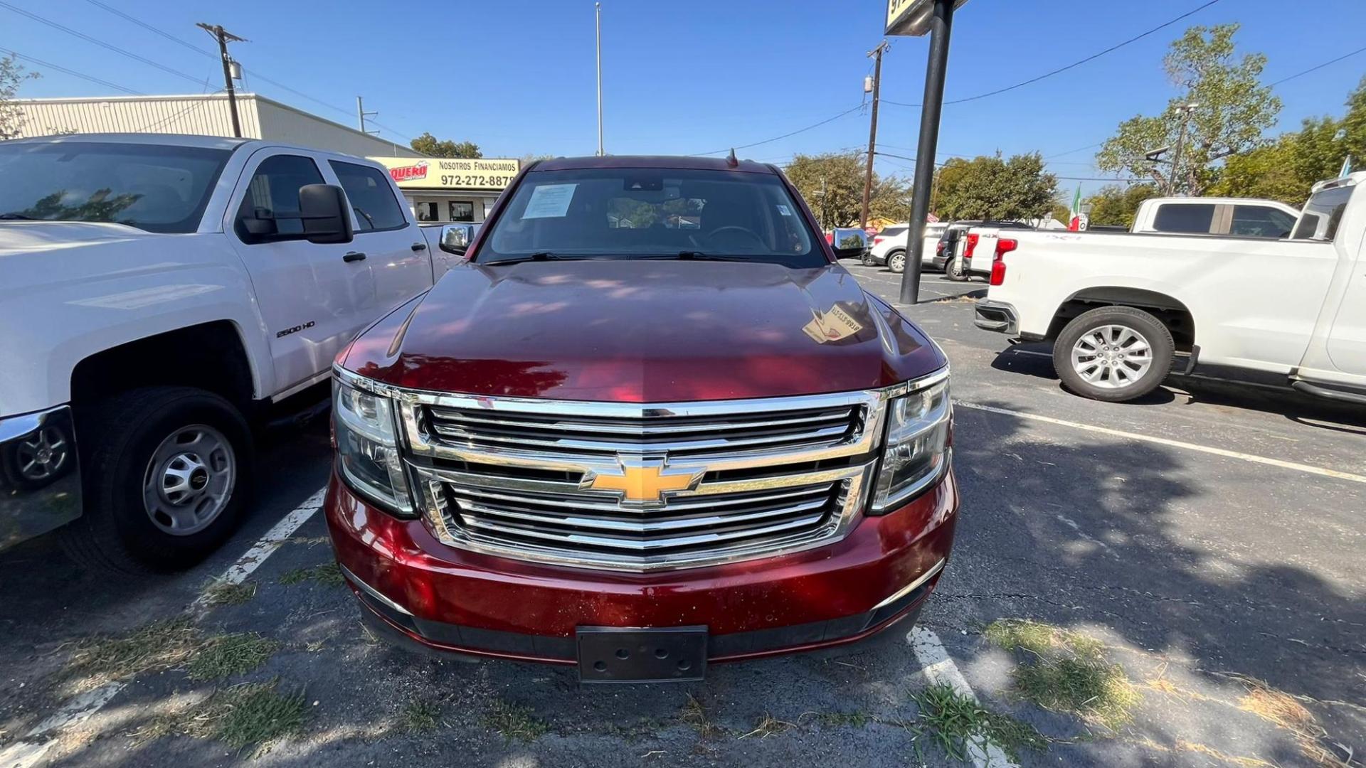 2017 Red Chevrolet Tahoe Premier 2WD (1GNSCCKC3HR) with an 5.3L V8 OHV 16V engine, 6A transmission, located at 945 E. Jefferson Blvd, Dallas, TX, 75203, (214) 943-7777, 32.752514, -96.811630 - Photo#1