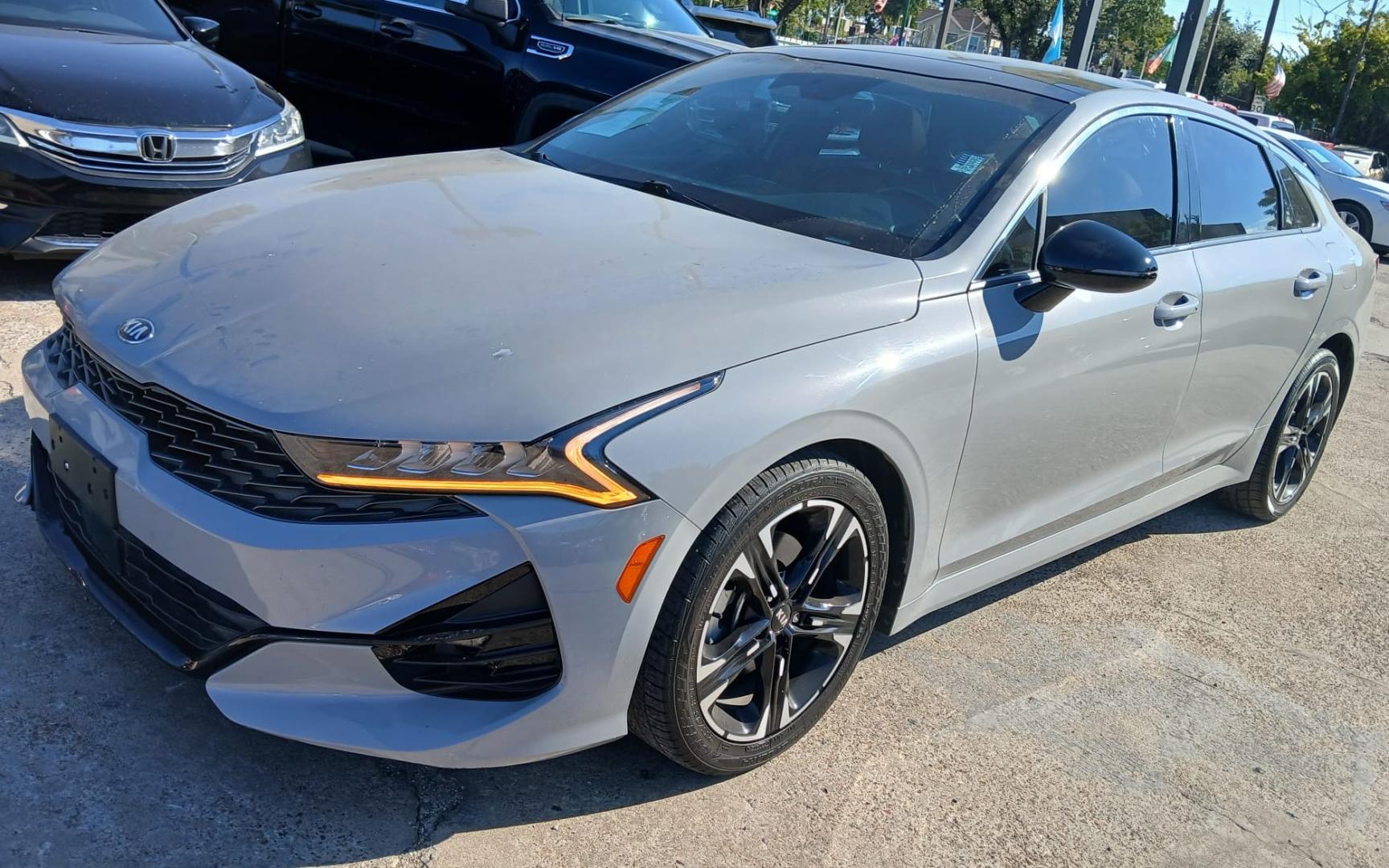 2021 Gray Kia K5 GT-Line (5XXG64J24MG) , located at 945 E. Jefferson Blvd, Dallas, TX, 75203, (214) 943-7777, 32.752514, -96.811630 - Photo#0