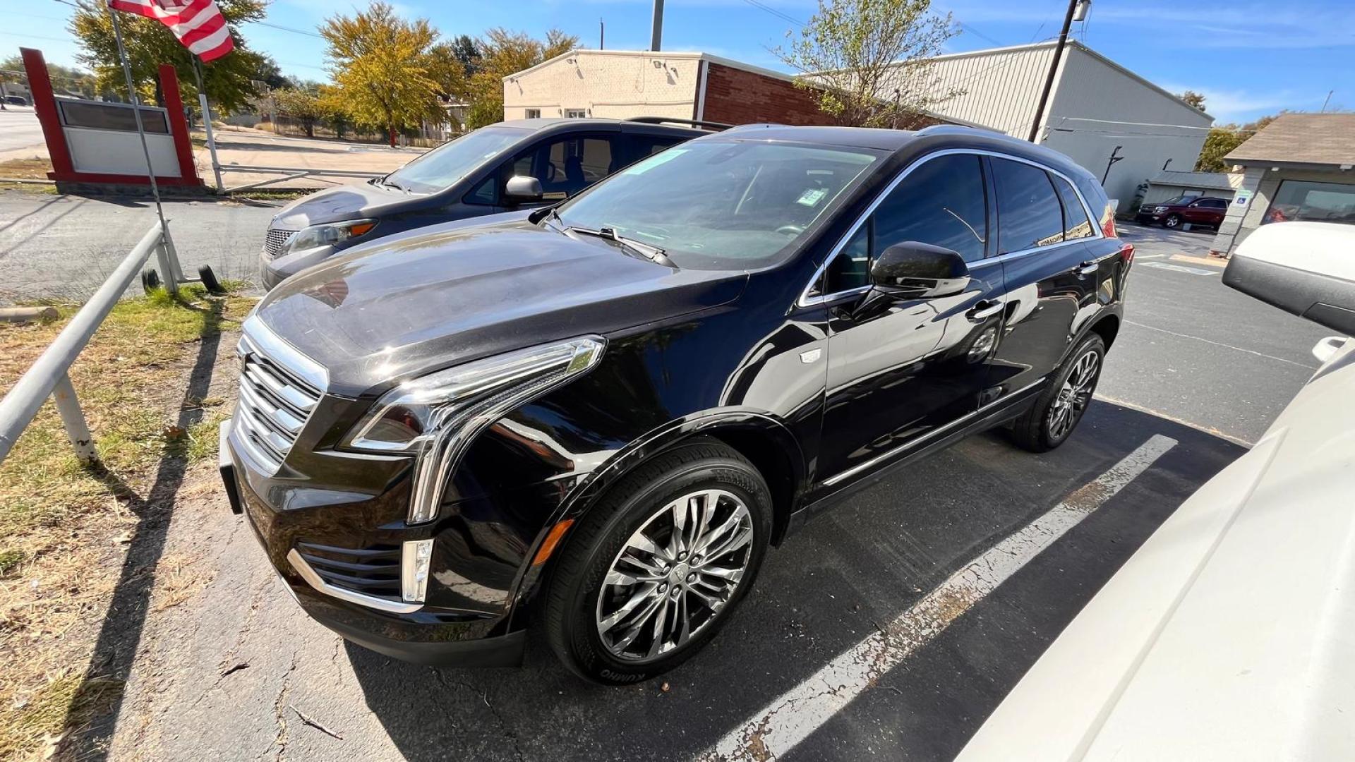 2017 Black Cadillac XT5 Luxury AWD (1GYKNCRS7HZ) with an 3.6L V6 DOHC 24V engine, 8A transmission, located at 945 E. Jefferson Blvd, Dallas, TX, 75203, (214) 943-7777, 32.752514, -96.811630 - Photo#0