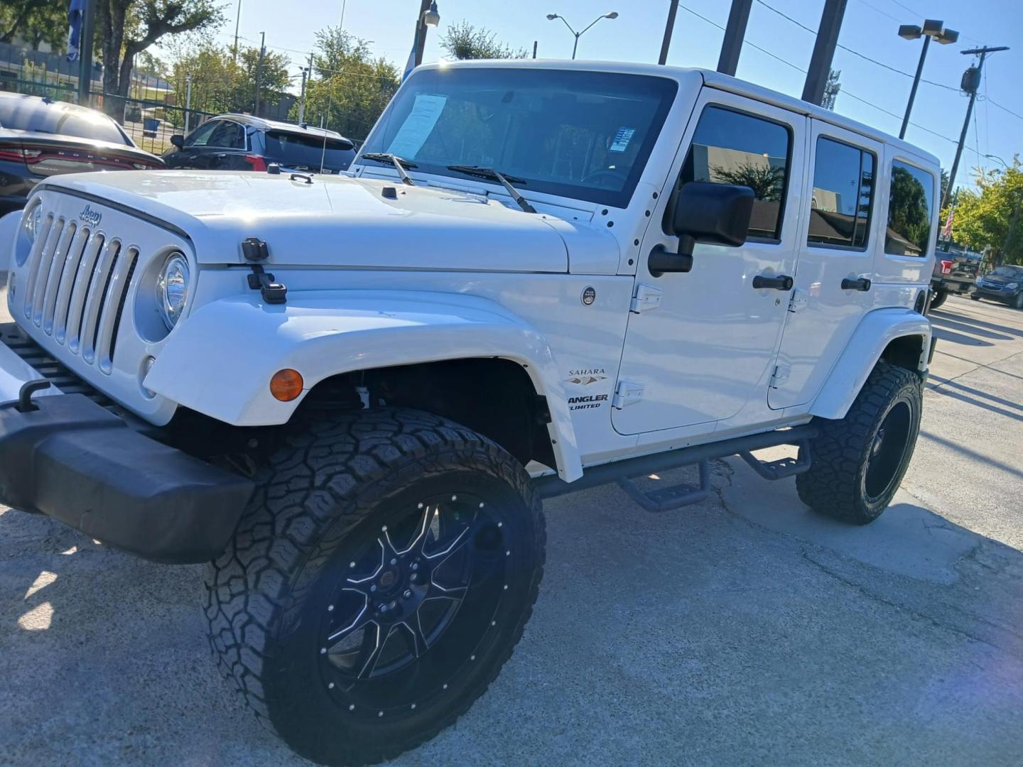 2017 white Jeep Wrangler Unlimited Sahara 4WD (1C4BJWEG2HL) with an 3.6L V6 DOHC 24V FFV engine, located at 945 E. Jefferson Blvd, Dallas, TX, 75203, (214) 943-7777, 32.752514, -96.811630 - Photo#0