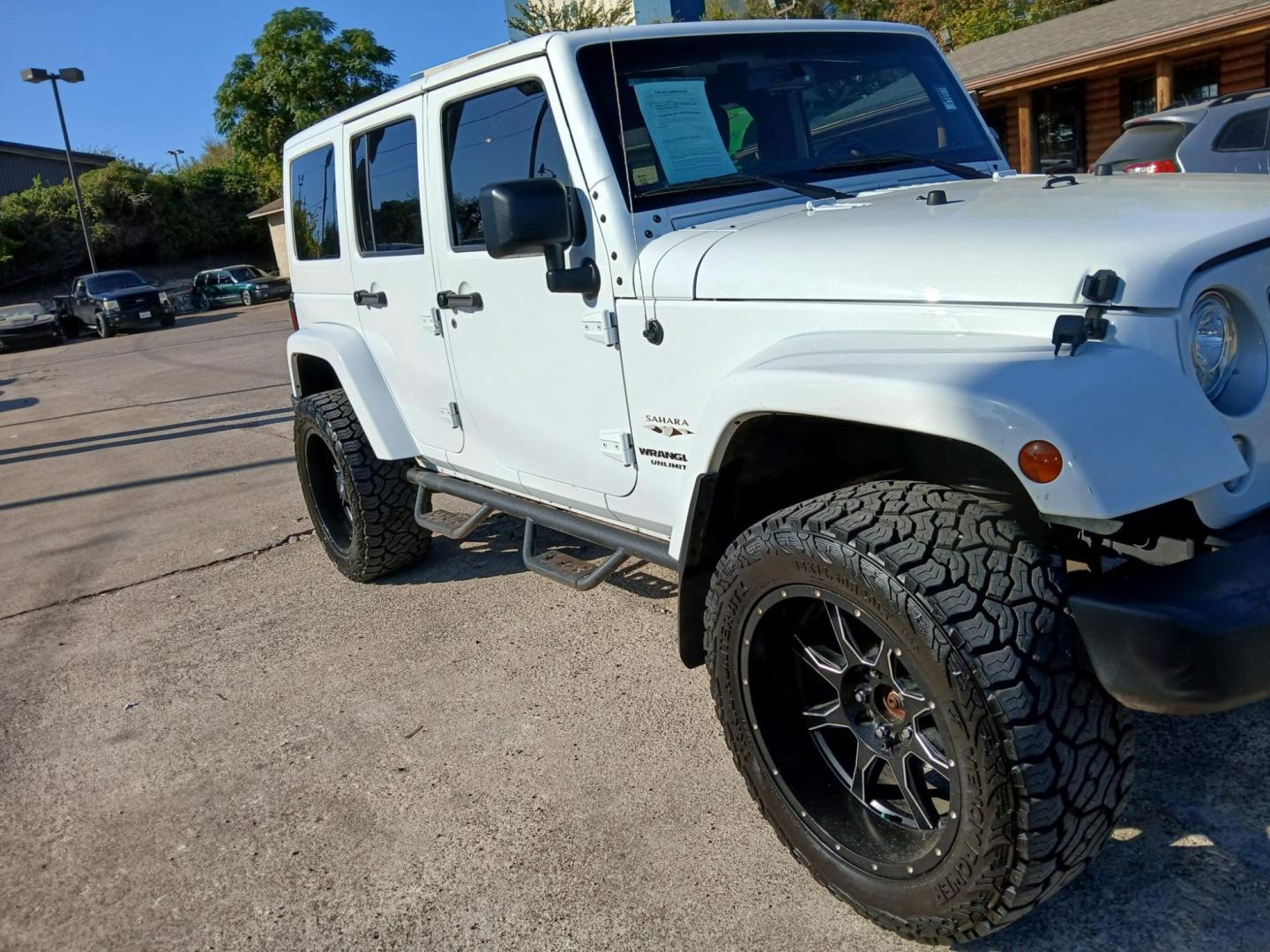 2017 white Jeep Wrangler Unlimited Sahara 4WD (1C4BJWEG2HL) with an 3.6L V6 DOHC 24V FFV engine, located at 945 E. Jefferson Blvd, Dallas, TX, 75203, (214) 943-7777, 32.752514, -96.811630 - Photo#2