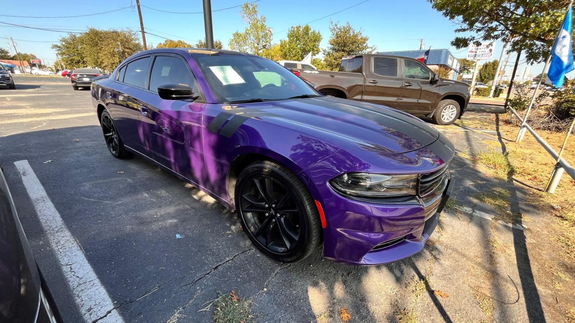 2018 Purple /Black Dodge Charger SE (2C3CDXBGXJH) with an 3.6L V6 DOHC 24V engine, 8A transmission, located at 945 E. Jefferson Blvd, Dallas, TX, 75203, (214) 943-7777, 32.752514, -96.811630 - Photo#2