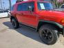 2012 Red Toyota FJ Cruiser 4WD MT (JTEBU4BF7CK) with an 3.4L V6 DOHC 24V engine, 6-Speed Manual transmission, located at 945 E. Jefferson Blvd, Dallas, TX, 75203, (214) 943-7777, 32.752514, -96.811630 - Photo#2