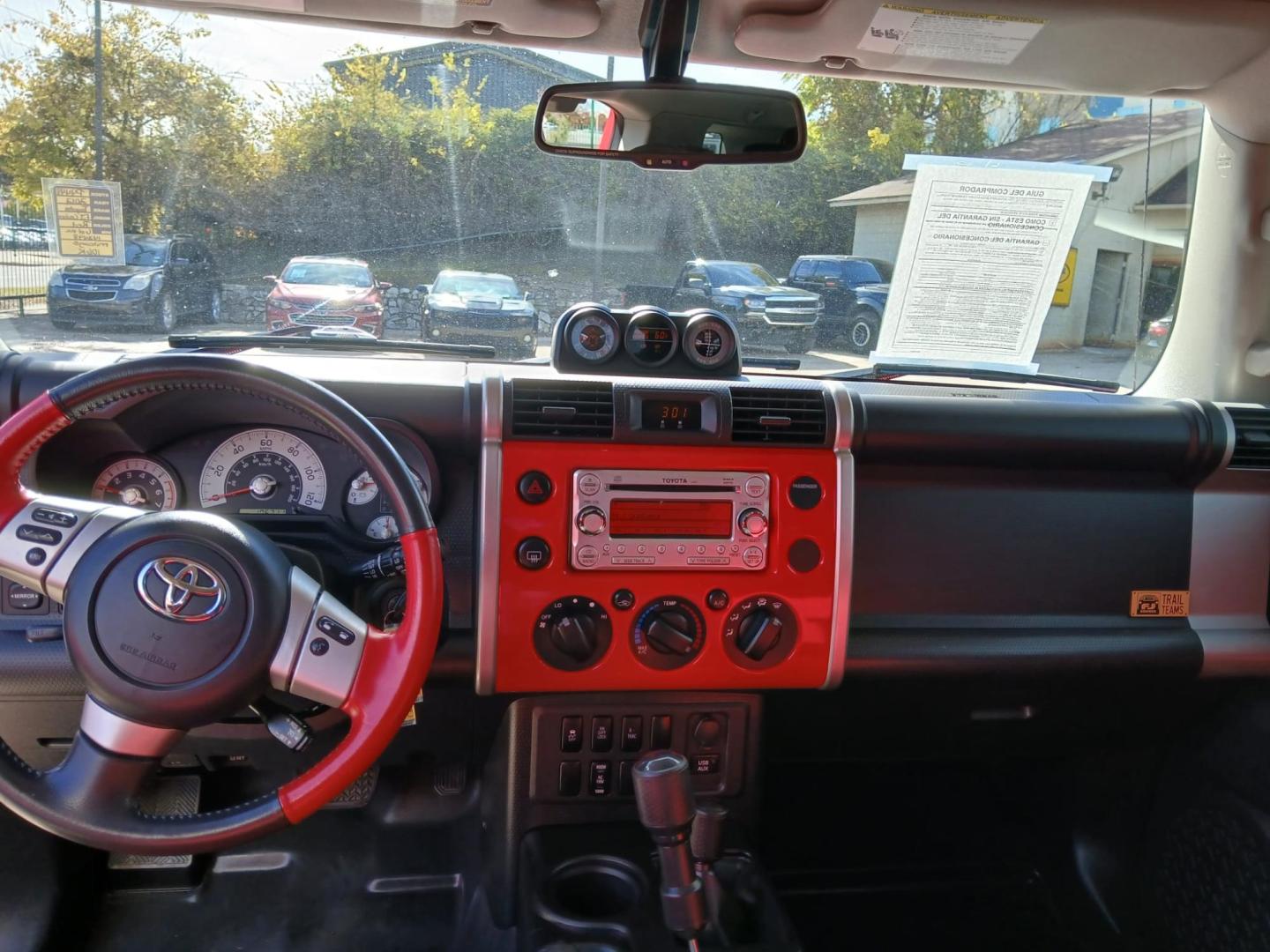 2012 Red Toyota FJ Cruiser 4WD MT (JTEBU4BF7CK) with an 3.4L V6 DOHC 24V engine, 6-Speed Manual transmission, located at 945 E. Jefferson Blvd, Dallas, TX, 75203, (214) 943-7777, 32.752514, -96.811630 - Photo#4