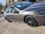 2021 Gray Toyota Camry SE (4T1G11AK6MU) with an 2.5L L4 DOHC 16V engine, 8A transmission, located at 945 E. Jefferson Blvd, Dallas, TX, 75203, (214) 943-7777, 32.752514, -96.811630 - Photo#1