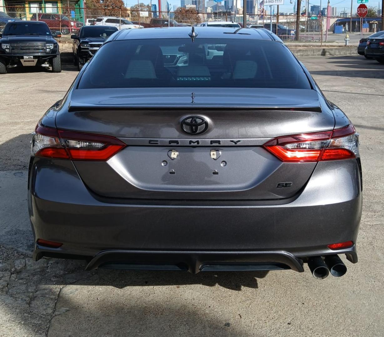 2021 Gray Toyota Camry SE (4T1G11AK6MU) with an 2.5L L4 DOHC 16V engine, 8A transmission, located at 945 E. Jefferson Blvd, Dallas, TX, 75203, (214) 943-7777, 32.752514, -96.811630 - Photo#2