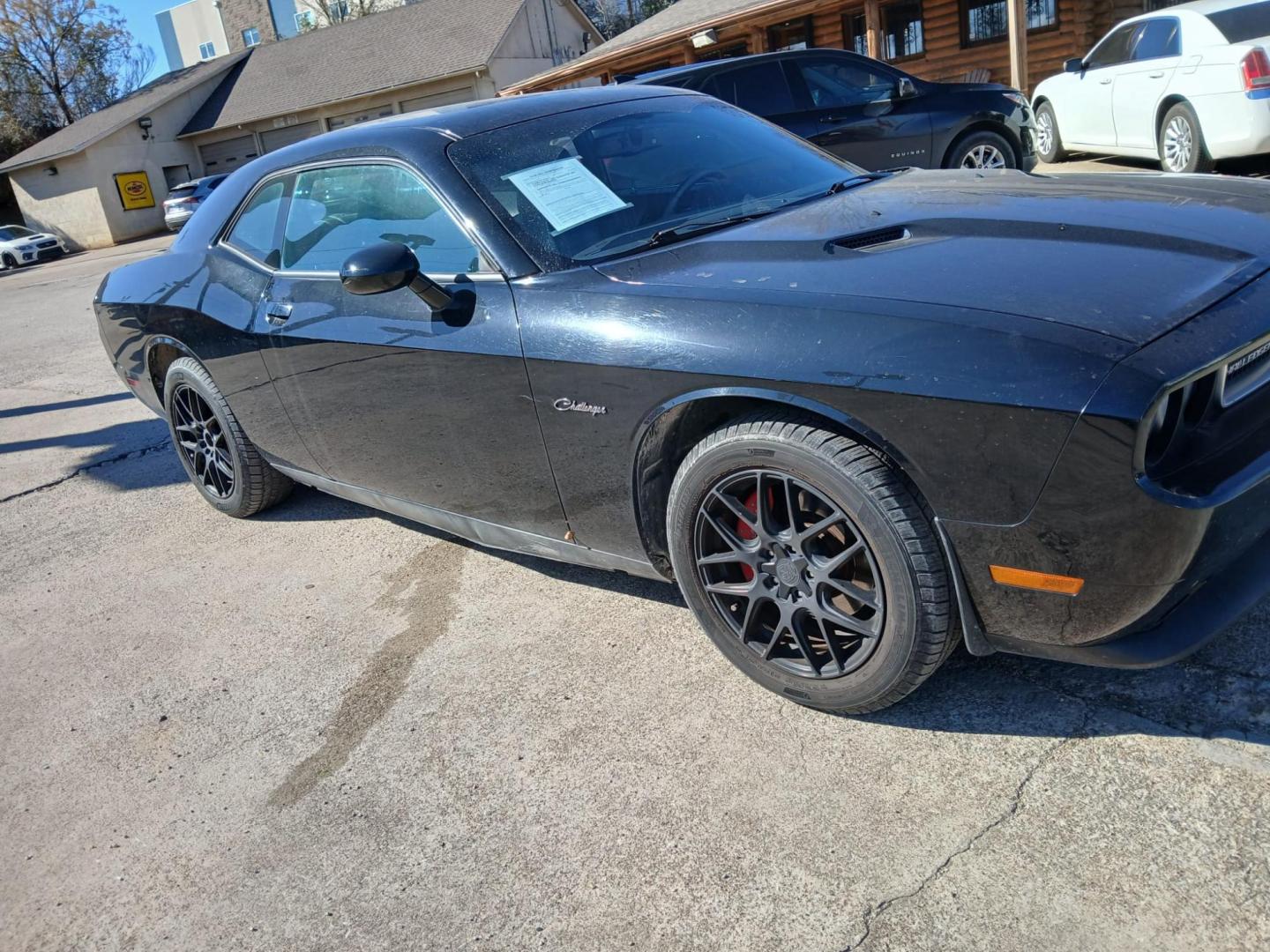 2014 Black Dodge Challenger SXT (2C3CDYAGXEH) with an 3.6L V6 DOHC 24V engine, 5-Speed Automatic transmission, located at 945 E. Jefferson Blvd, Dallas, TX, 75203, (214) 943-7777, 32.752514, -96.811630 - Photo#2