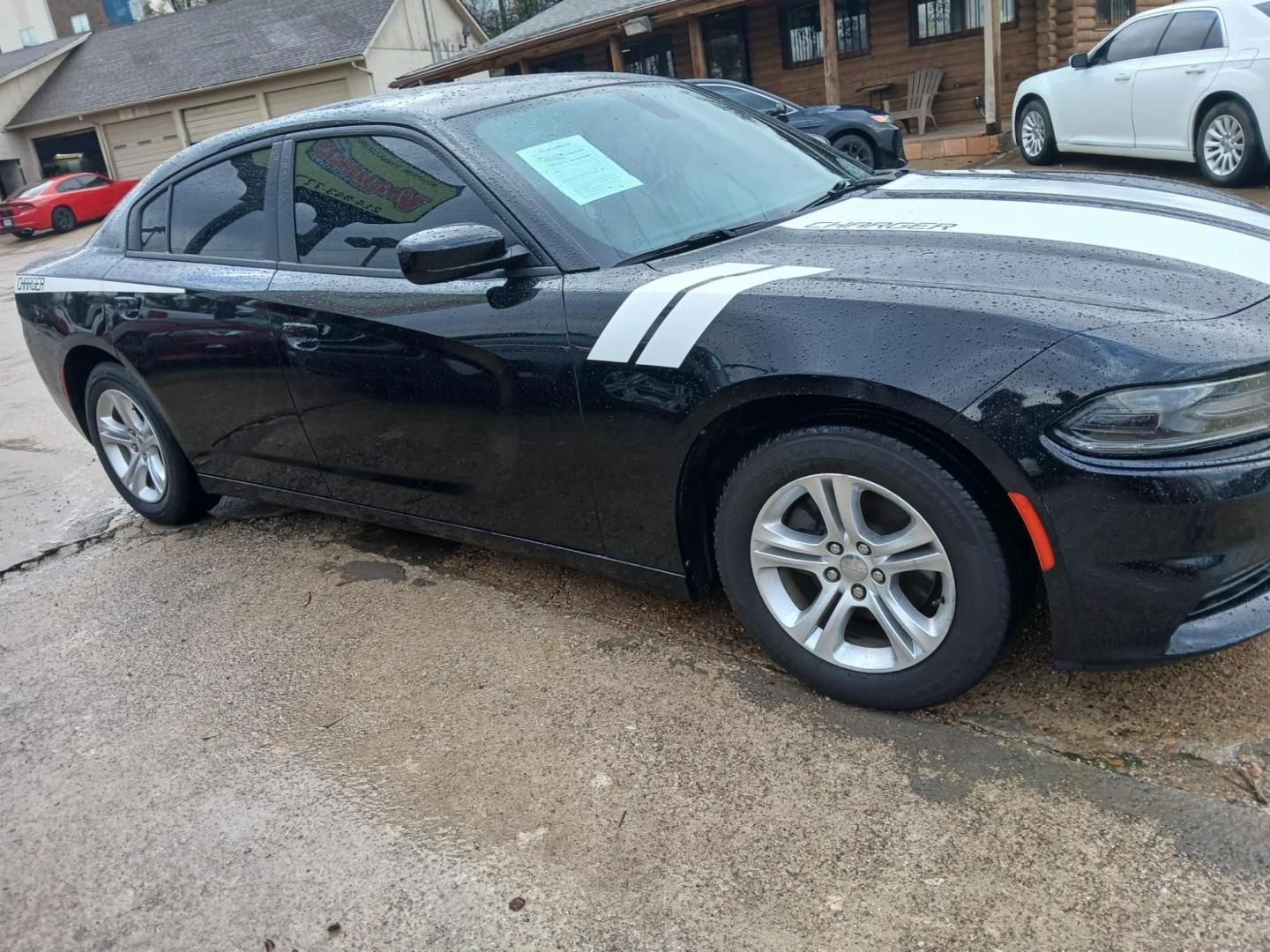 2020 Black Dodge Charger SXT (2C3CDXBG0LH) with an 3.6L V6 DOHC 24V engine, 8A transmission, located at 945 E. Jefferson Blvd, Dallas, TX, 75203, (214) 943-7777, 32.752514, -96.811630 - Photo#2